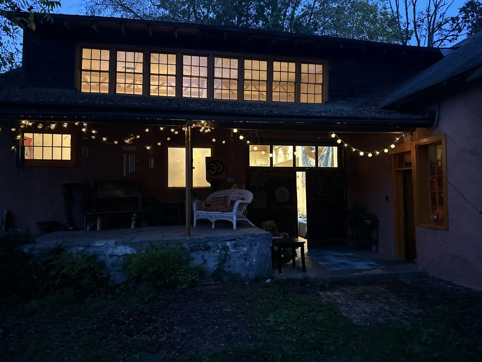 The sanctuary building glowing warmly at dusk