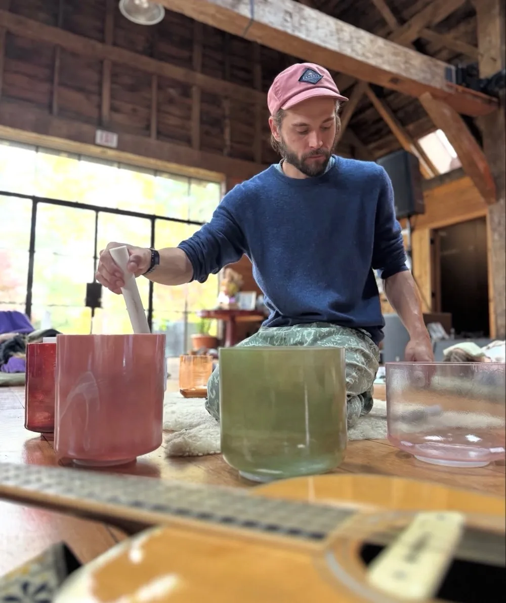 Josh Hines playing crystal singing bowls